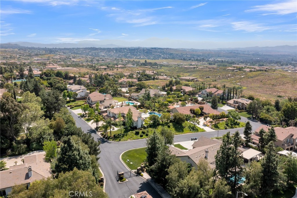 7535 Misty View Place Riverside, CA 92506 - Photo 71 of 75 an aerial view of residential building and lake