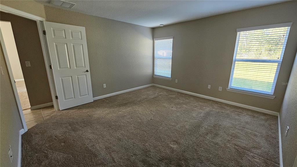 15944 Southwest 53rd Court Ocala, FL 34473 - Photo 16 of 22 a view of an empty room with windows