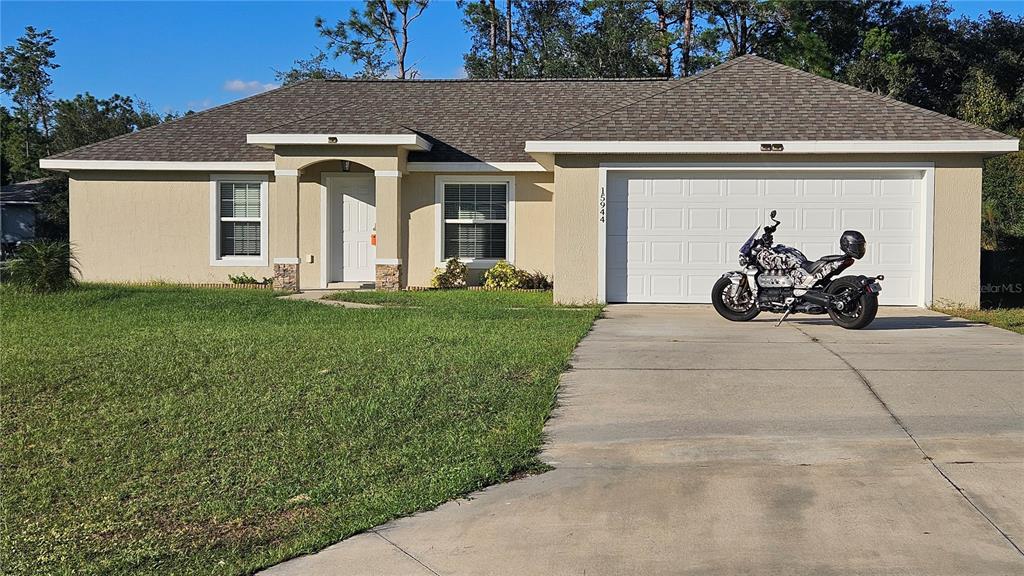 15944 Southwest 53rd Court Ocala, FL 34473 - Photo 2 of 22 a view of a house with yard
