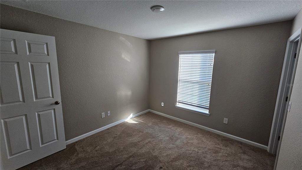15944 Southwest 53rd Court Ocala, FL 34473 - Photo 22 of 22 an empty room with windows