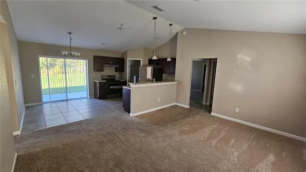 a view of a electric appliances in kitchen and empty room