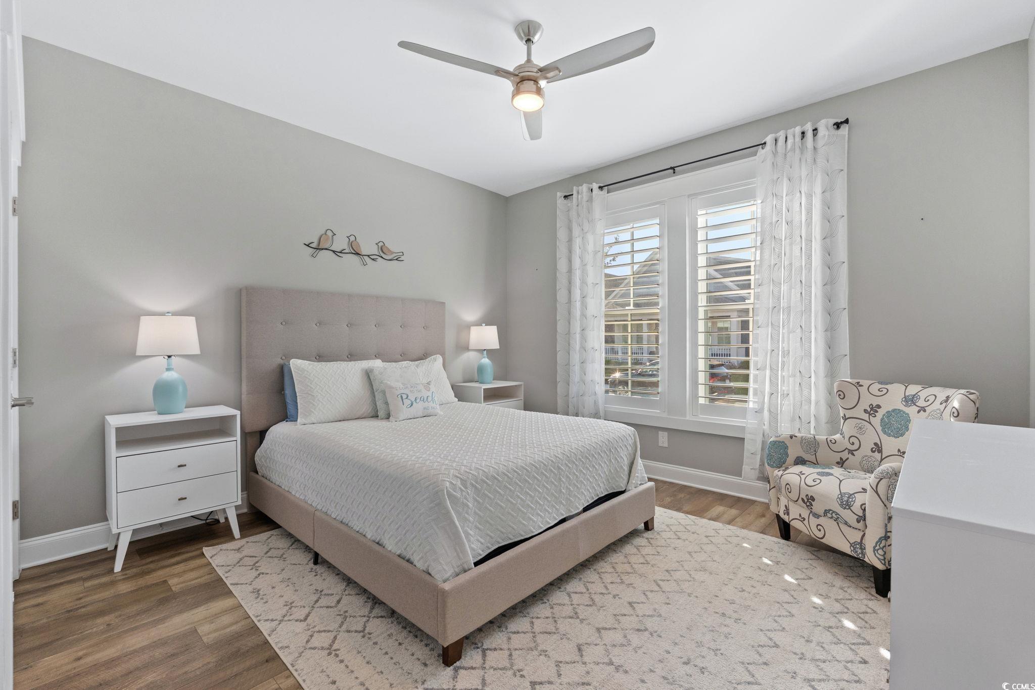 8336 Sandlapper Way Myrtle Beach, SC 29572 - Photo 24 of 40 Bedroom featuring wood finished floors and a ceiling fan