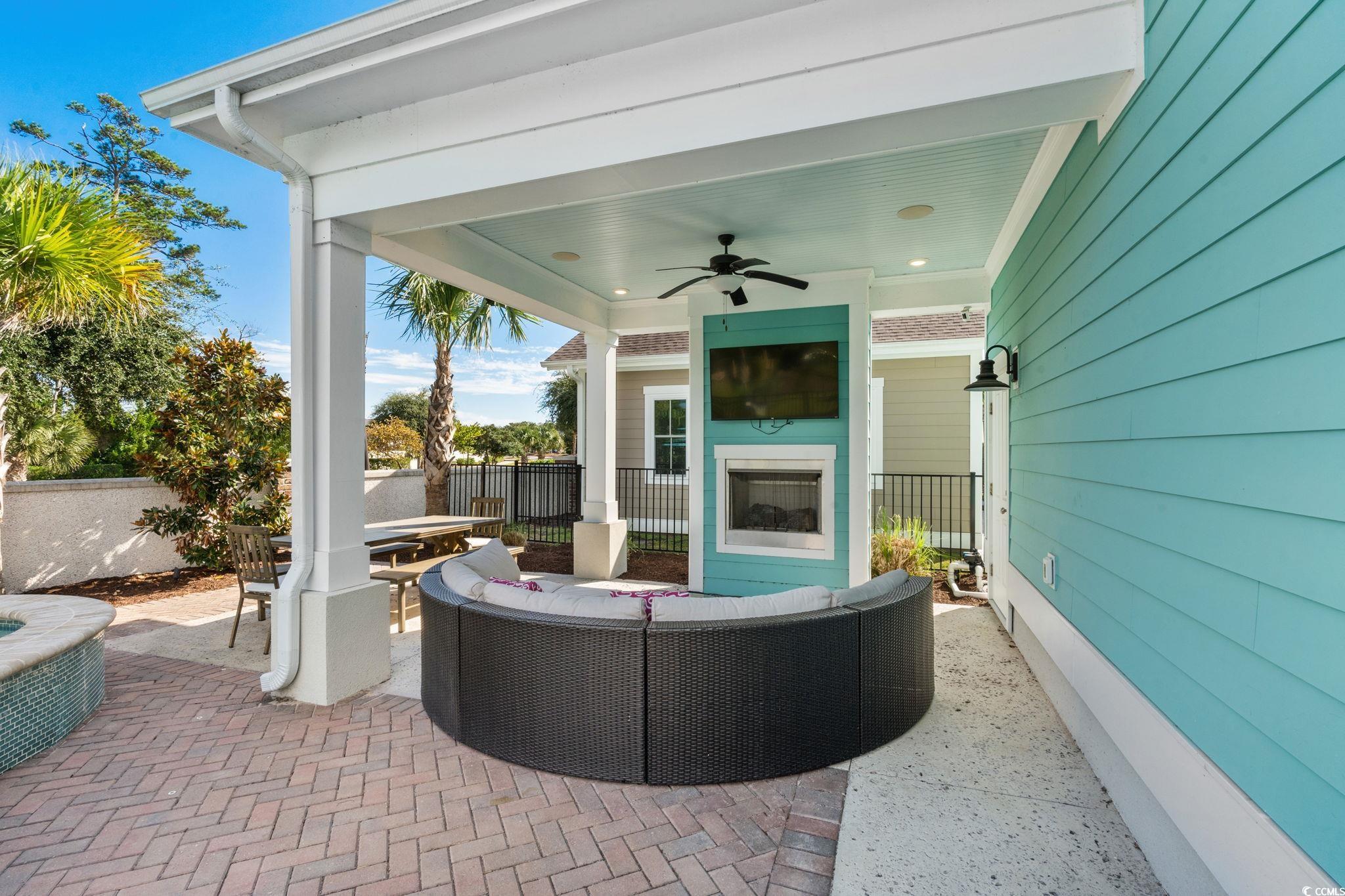 8336 Sandlapper Way Myrtle Beach, SC 29572 - Photo 29 of 40 View of patio / terrace featuring a ceiling fan, an outdoor living space, and outdoor dining area