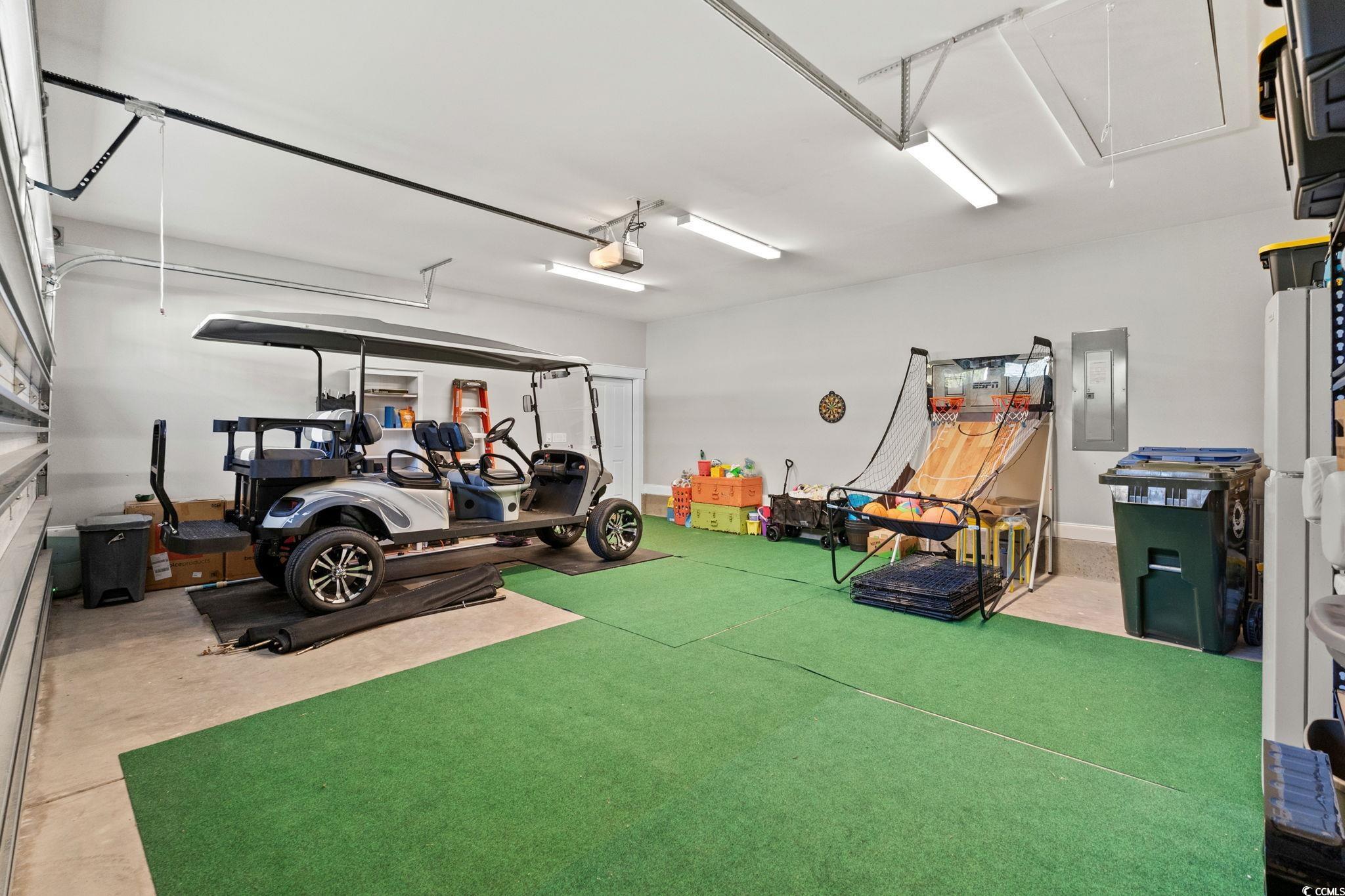 8336 Sandlapper Way Myrtle Beach, SC 29572 - Photo 34 of 40 Garage featuring electric panel