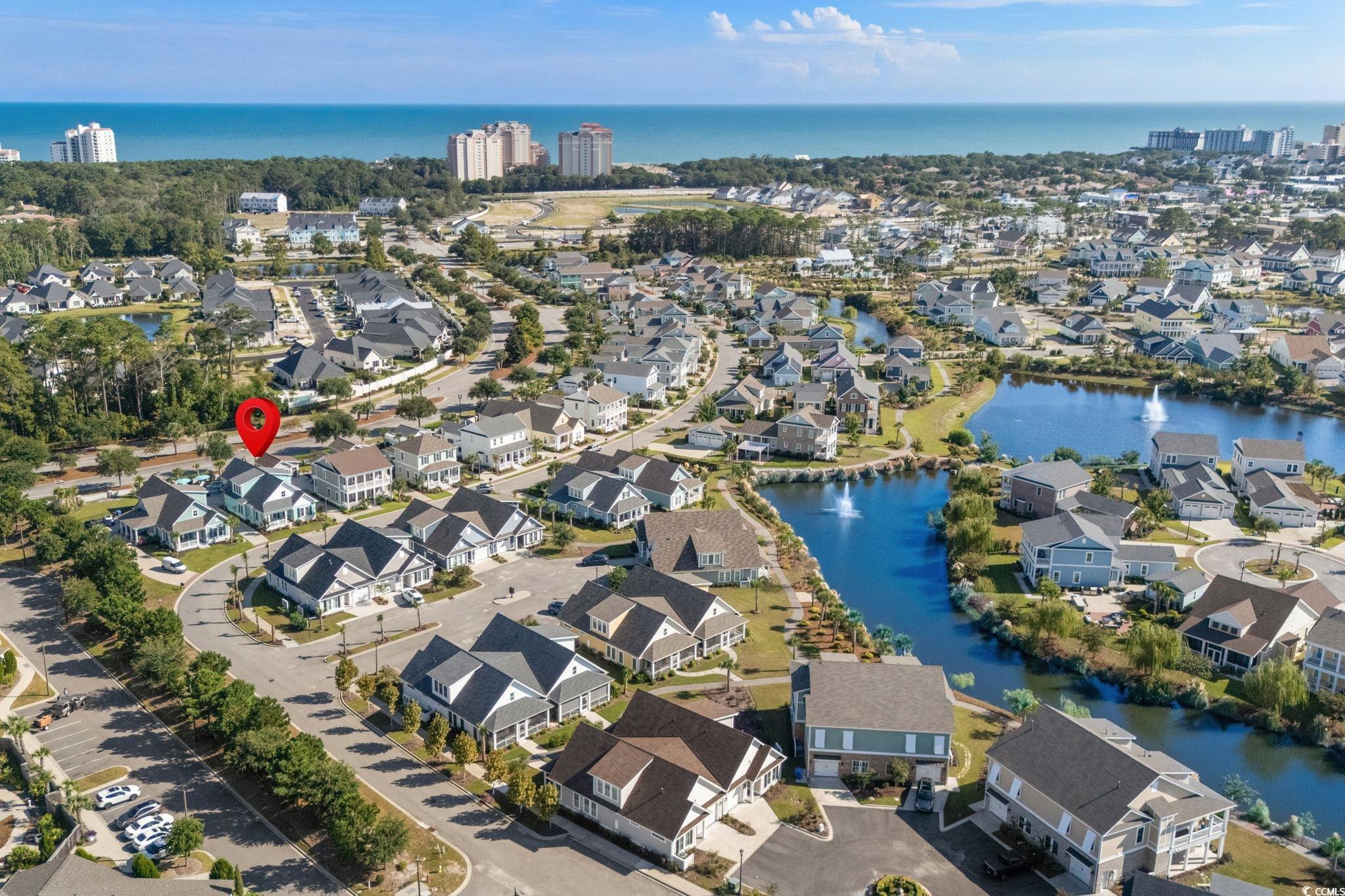 8336 Sandlapper Way Myrtle Beach, SC 29572 - Photo 35 of 40 Aerial overview of property's location with a large body of water and nearby suburban area