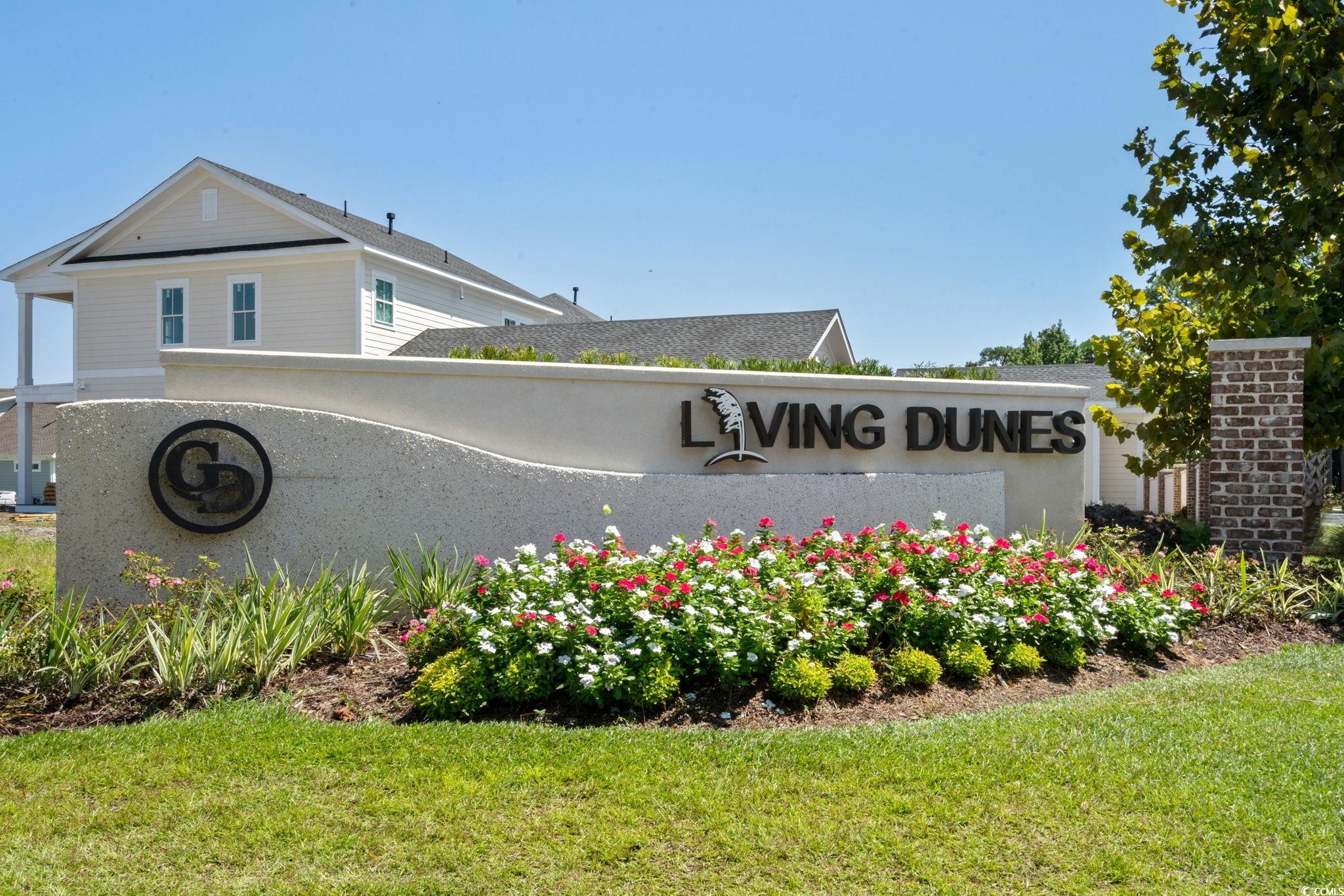8336 Sandlapper Way Myrtle Beach, SC 29572 - Photo 37 of 40 Community / neighborhood sign with a yard