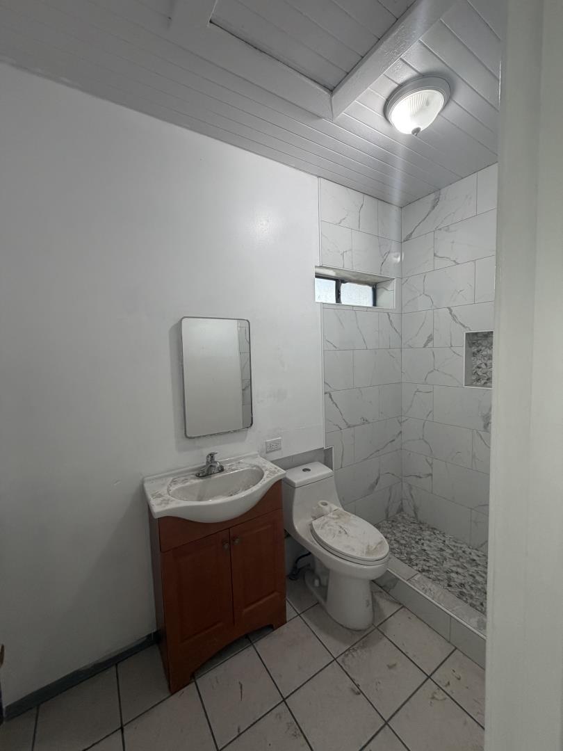 2340 Alisal Road, Unit A Salinas, CA 93908 - Photo 13 of 25 a bathroom with a toilet sink and mirror