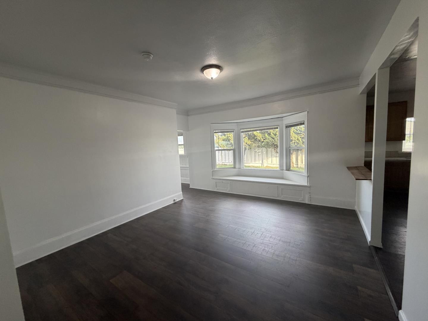 2340 Alisal Road, Unit A Salinas, CA 93908 - Photo 15 of 25 an empty room with wooden floor and windows