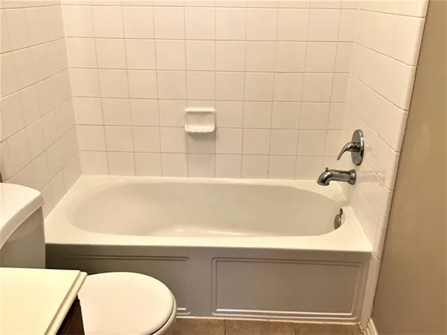 a view of a room with tiles and windows