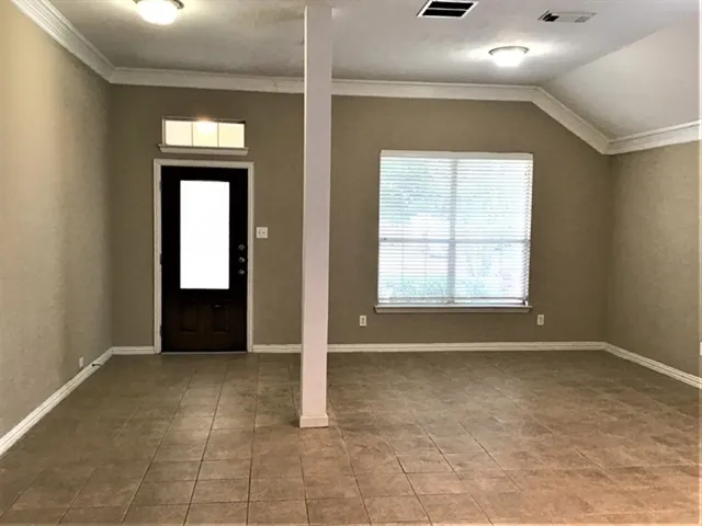 en view of an empty room with a window