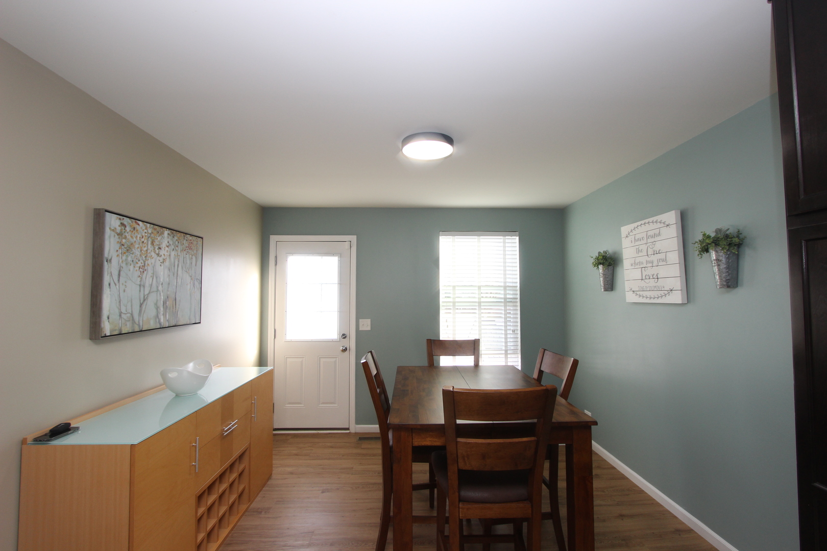 1856 Butterfield Road Woodstock, IL 60098 - Photo 7 of 26 a view of a dining room with furniture and window