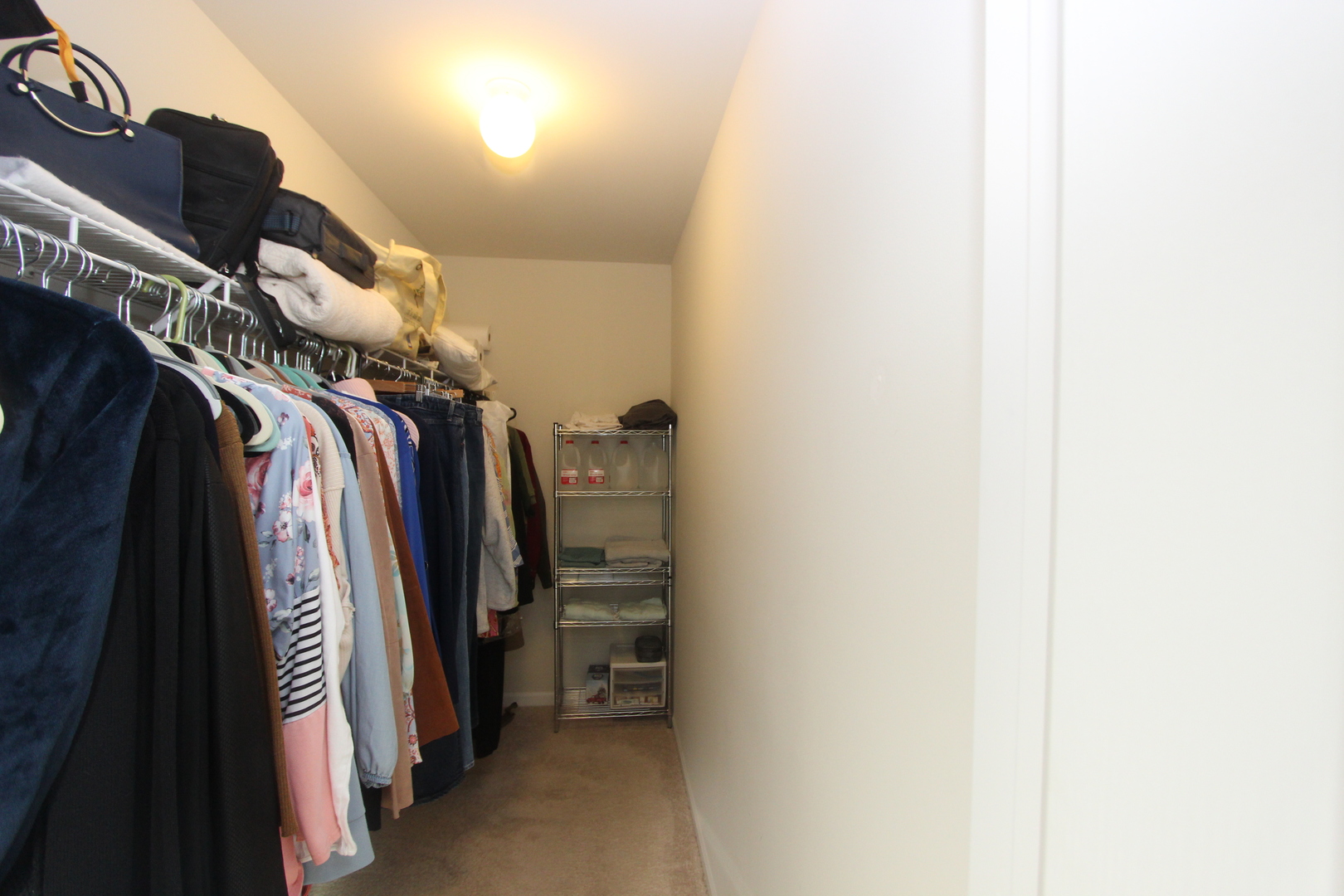 1856 Butterfield Road Woodstock, IL 60098 - Photo 10 of 26 a view of walk in closet with clothes