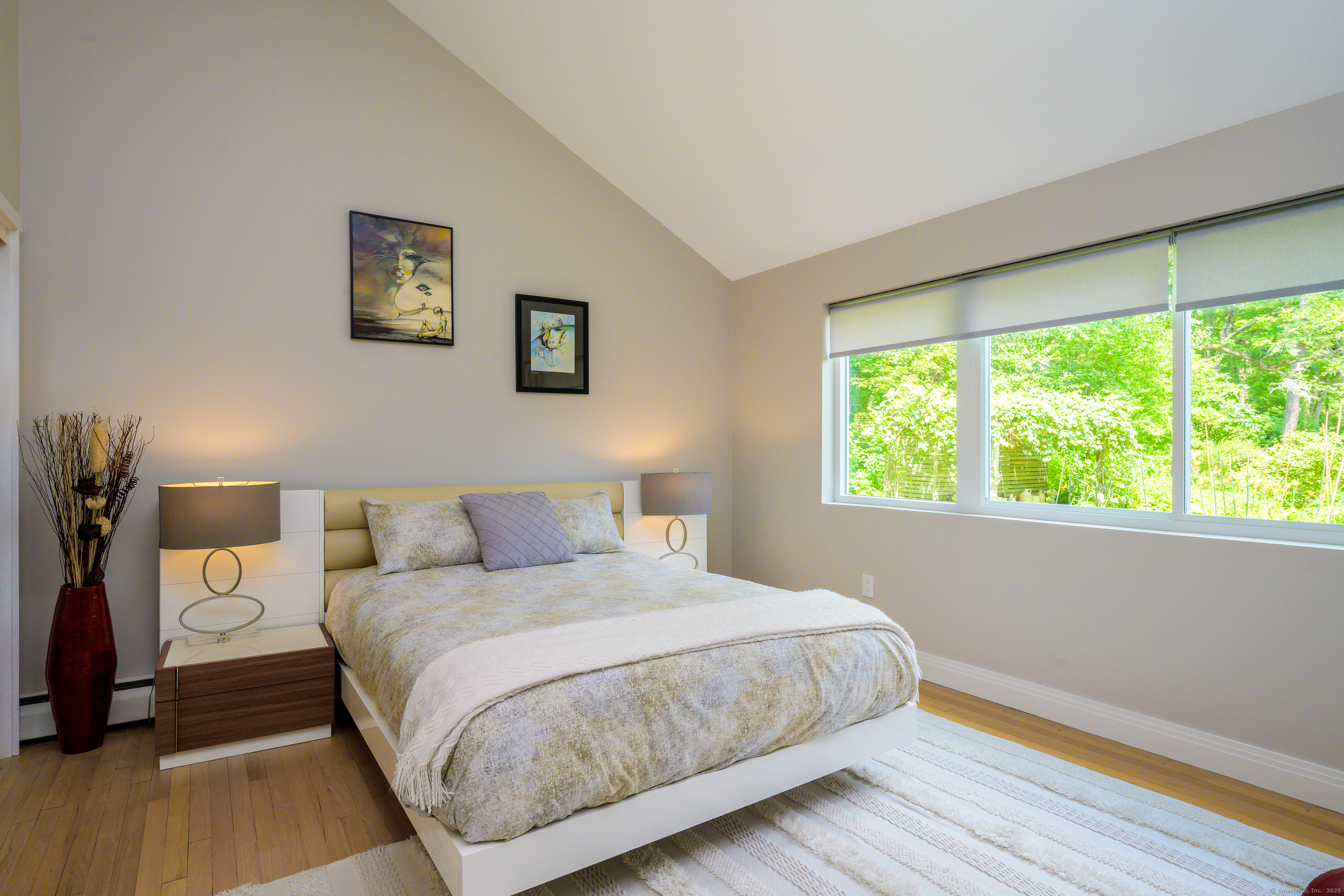 35 Kirk Road Sharon, CT 06796 - Photo 34 of 40 a bedroom with a bed and a large window