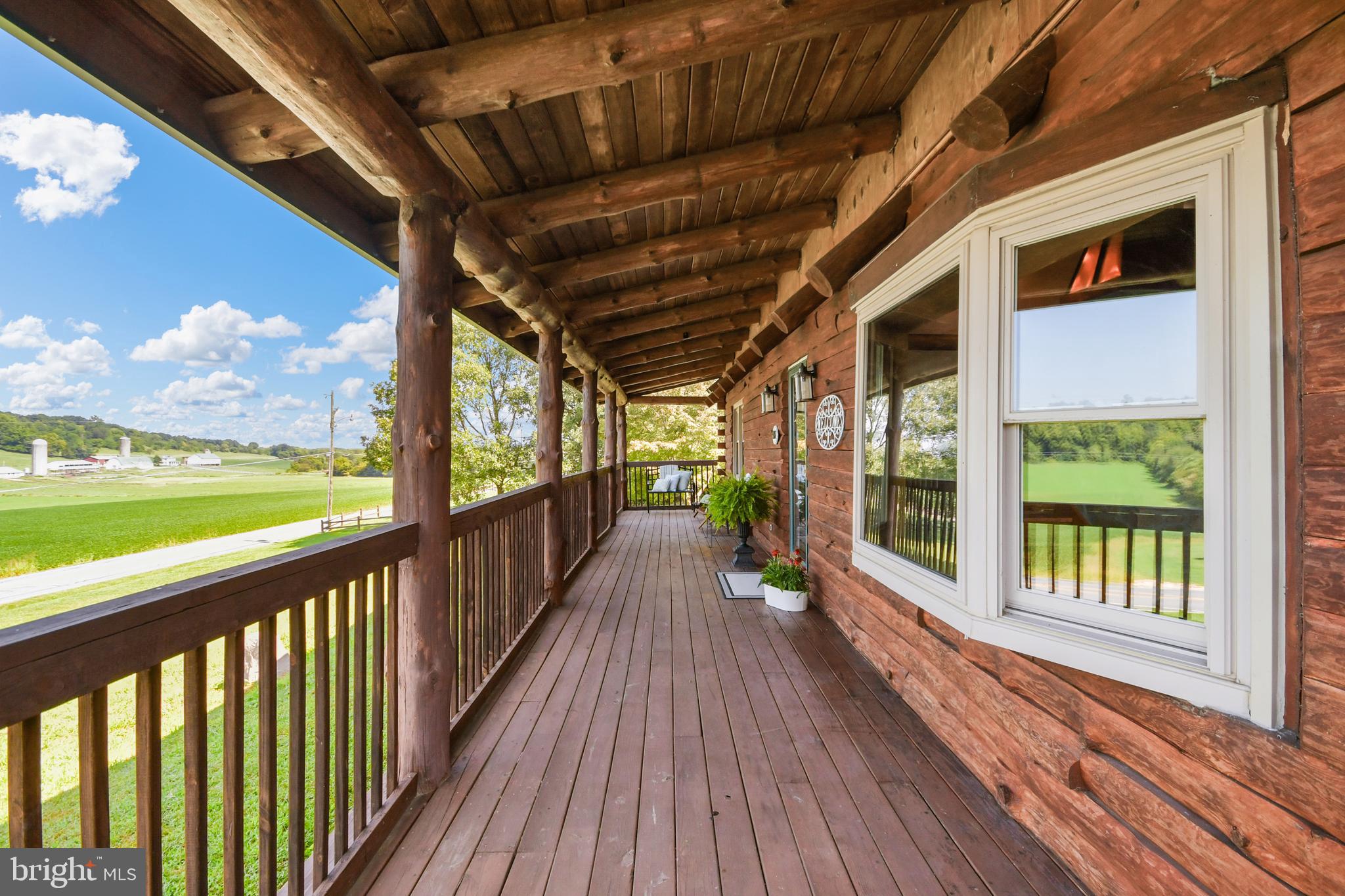A 'dream' of a front porch overlooks scenic views.