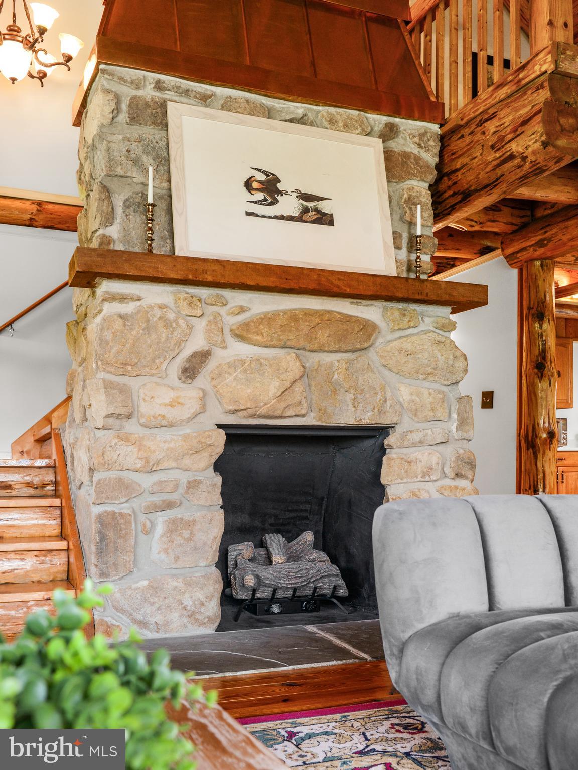 Custom stone fireplace w/mantel adds the cozy!