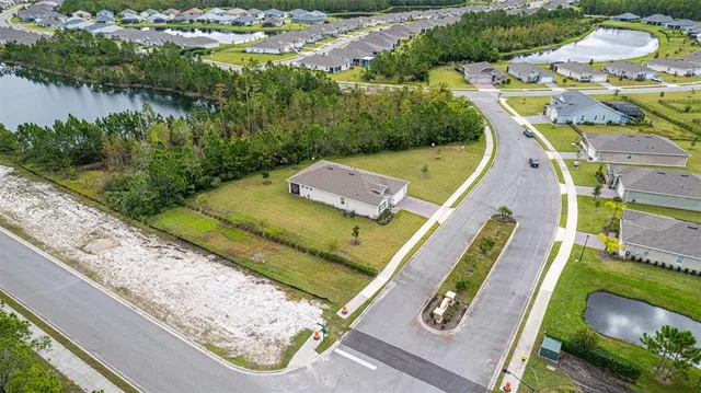 a view of a swimming pool with a yard