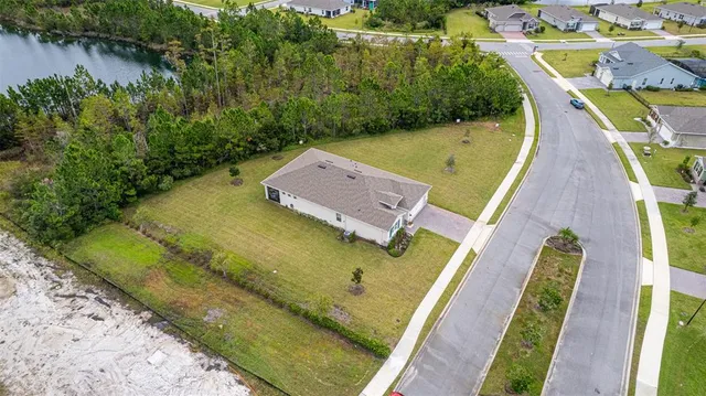 an aerial view of a house with a garden