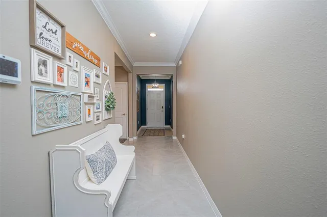a view of a hallway with paintings on the wall
