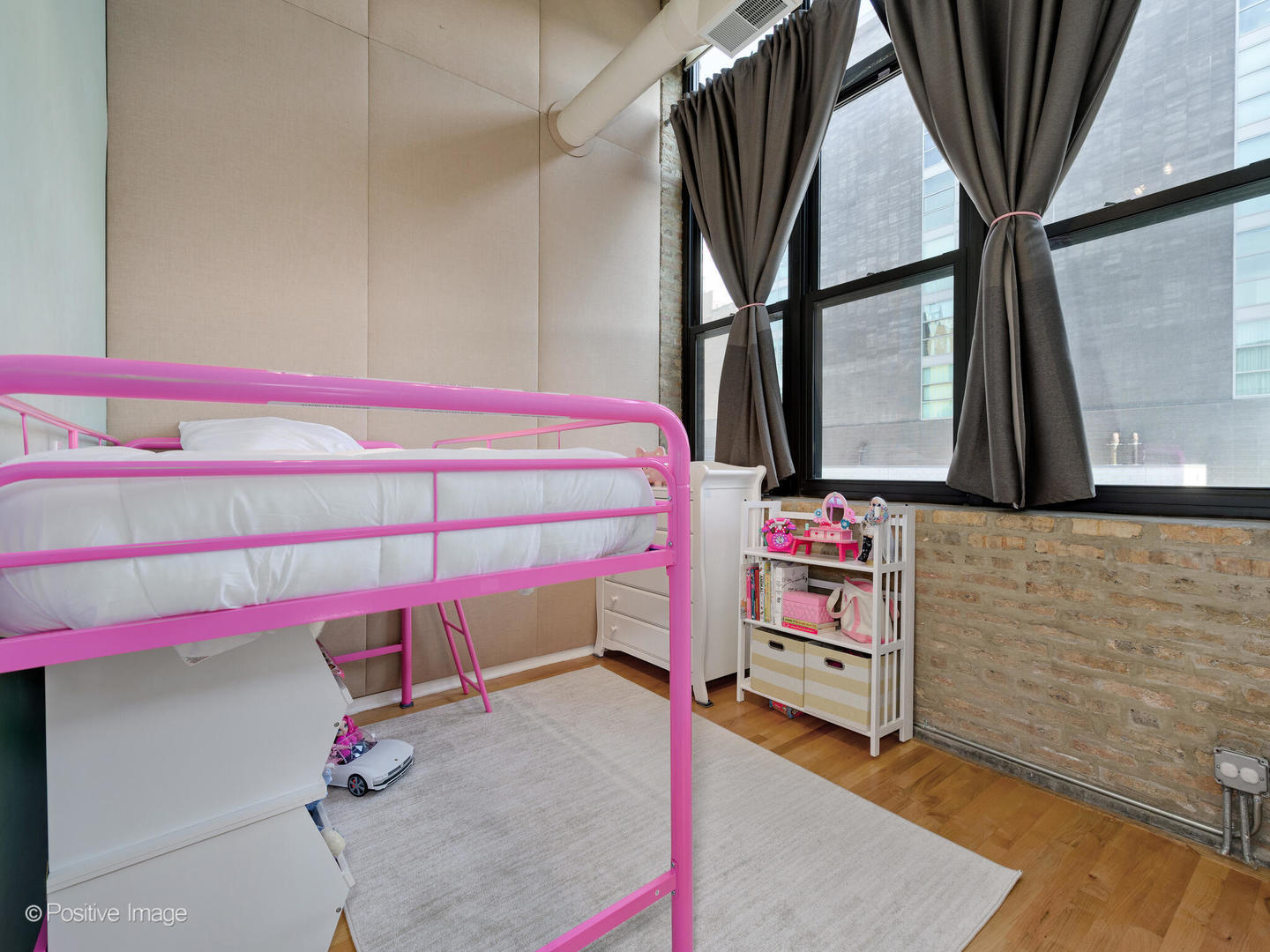 203 South Sangamon Street, Unit 213 Chicago, IL 60607 - Photo 18 of 23 a bedroom with a bed and a mirror