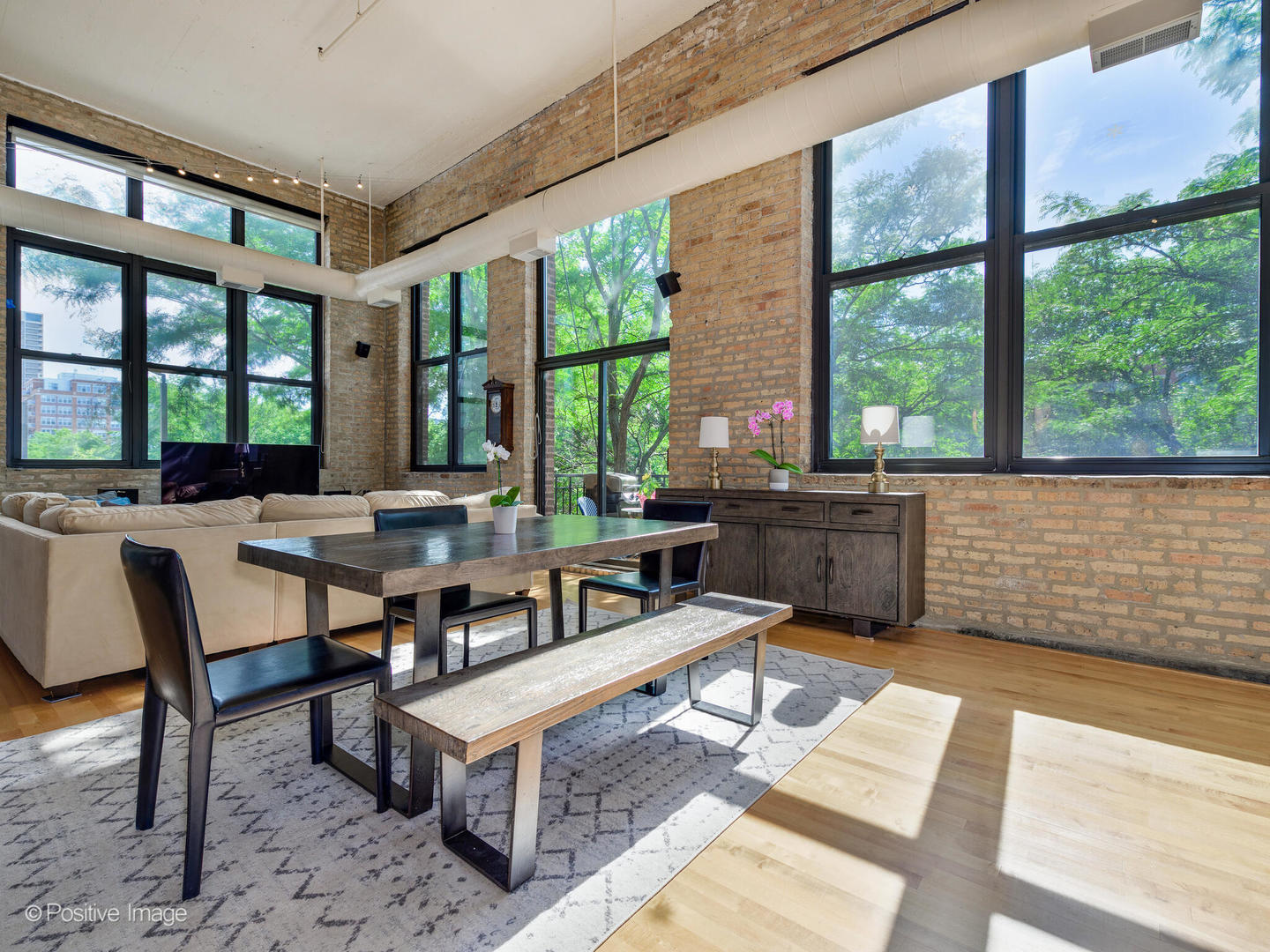 203 South Sangamon Street, Unit 213 Chicago, IL 60607 - Photo 2 of 23 a living room with furniture and large windows