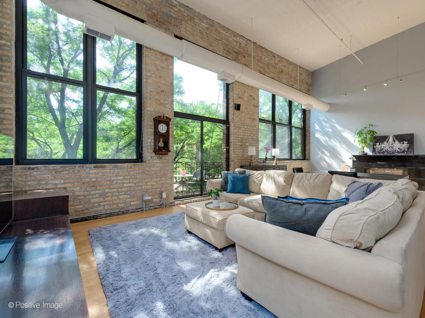 203 South Sangamon Street, Unit 213 Chicago, IL 60607 - Photo 3 of 23 a living room with furniture and a large window