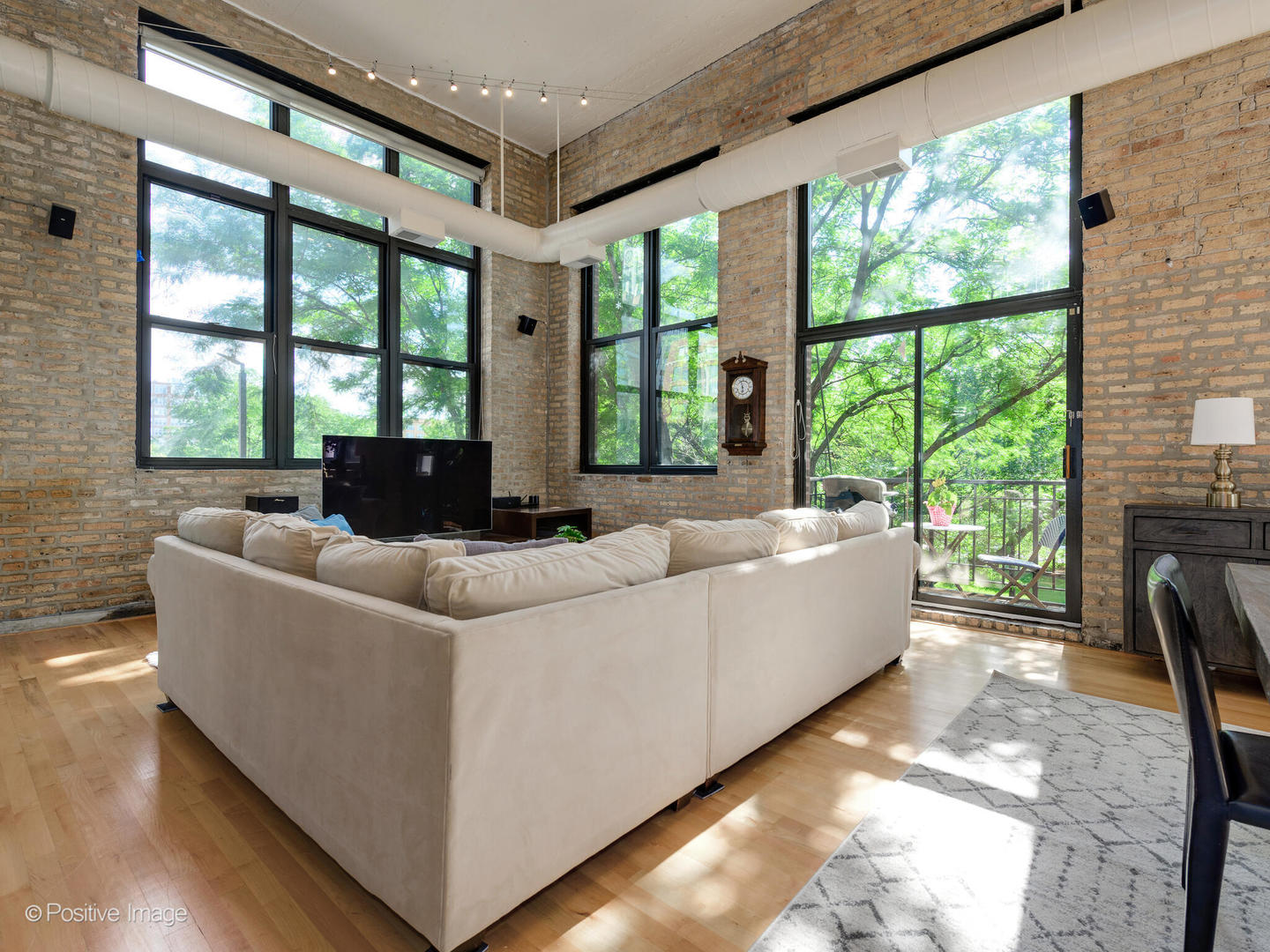 203 South Sangamon Street, Unit 213 Chicago, IL 60607 - Photo 4 of 23 a living room with furniture and a large window