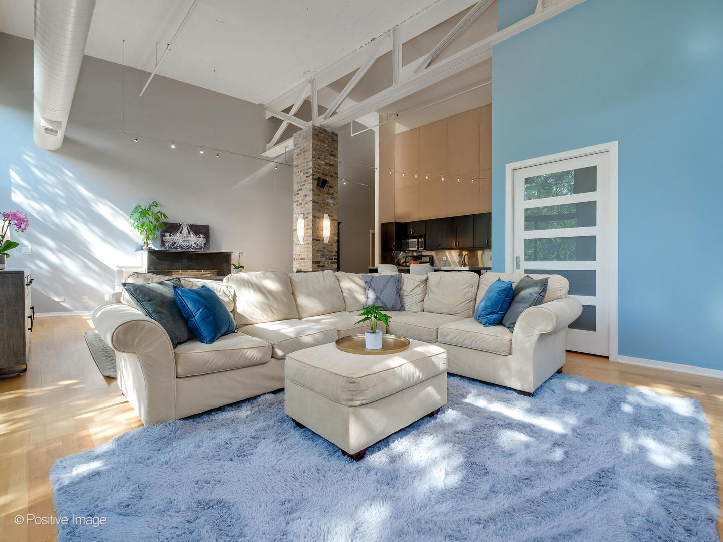 203 South Sangamon Street, Unit 213 Chicago, IL 60607 - Photo 7 of 23 a living room with furniture a fireplace and a chandelier