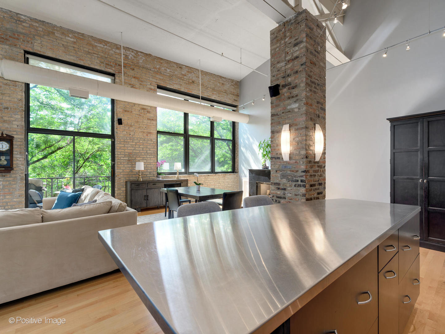203 South Sangamon Street, Unit 213 Chicago, IL 60607 - Photo 8 of 23 a living room with furniture and large windows