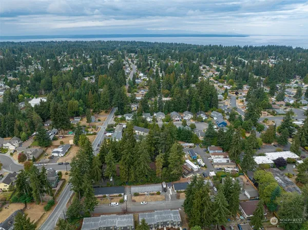 an aerial view of city with green space