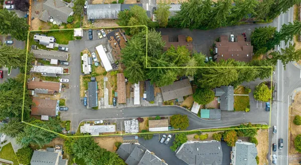 an aerial view of a house with swimming pool and garden