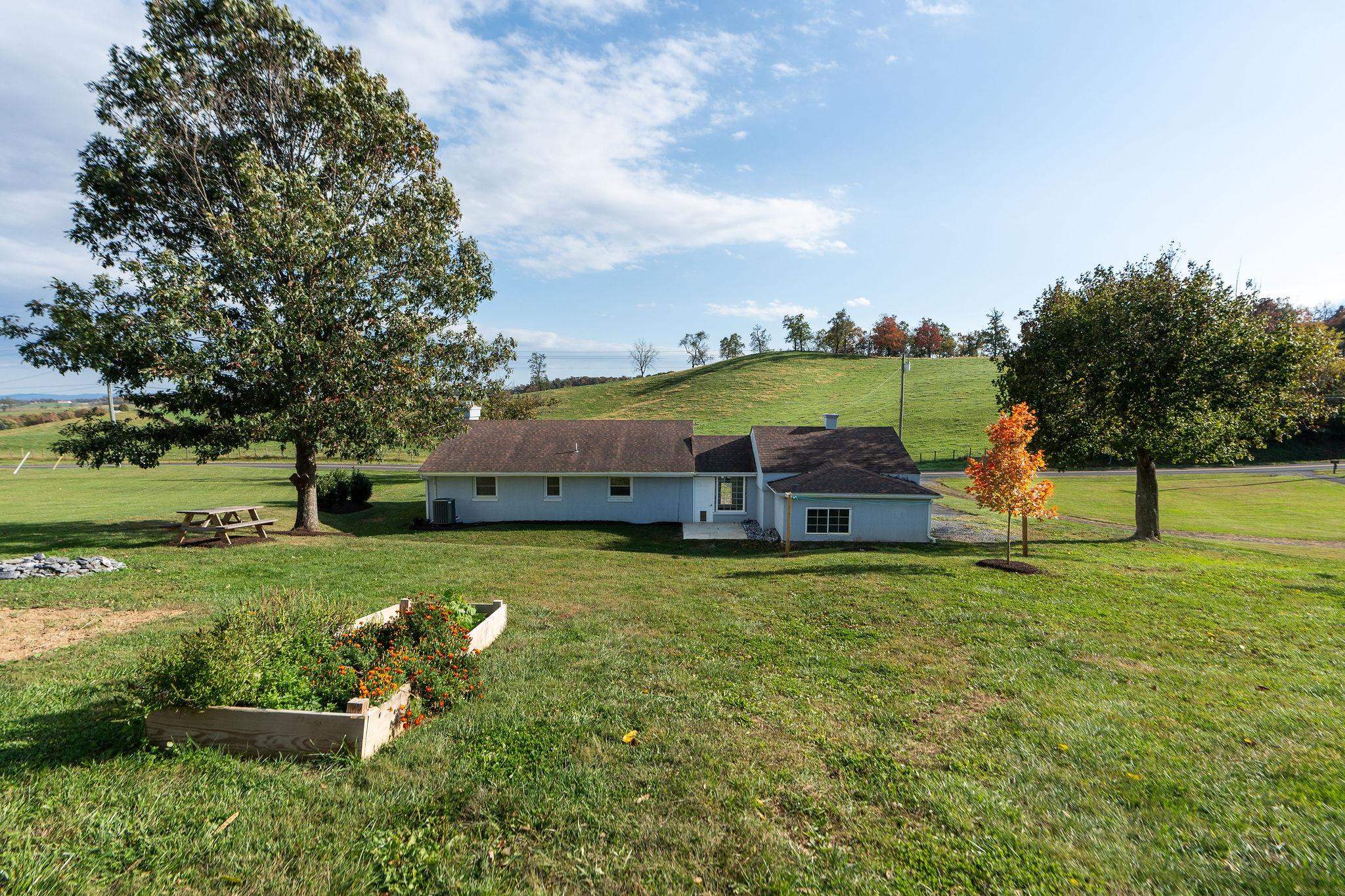 1111 Jennings Gap Road Churchville, VA 24421 - Photo 13 of 75 an aerial view of a house with a yard basket ball court and trampoline