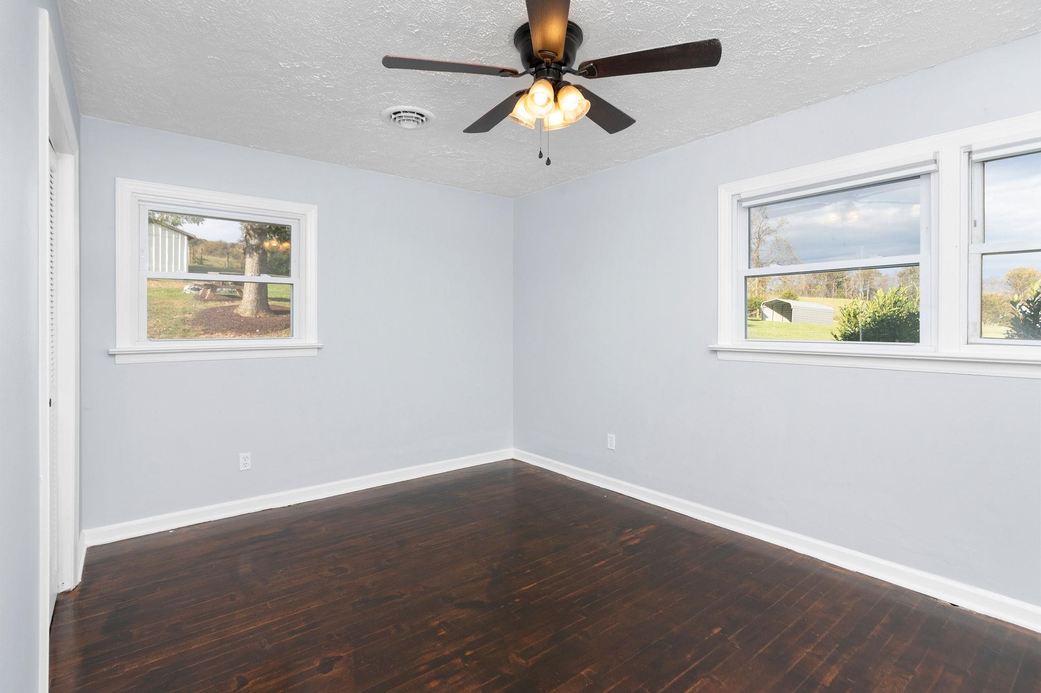 1111 Jennings Gap Road Churchville, VA 24421 - Photo 19 of 75 a view of an empty room with a window and wooden floor