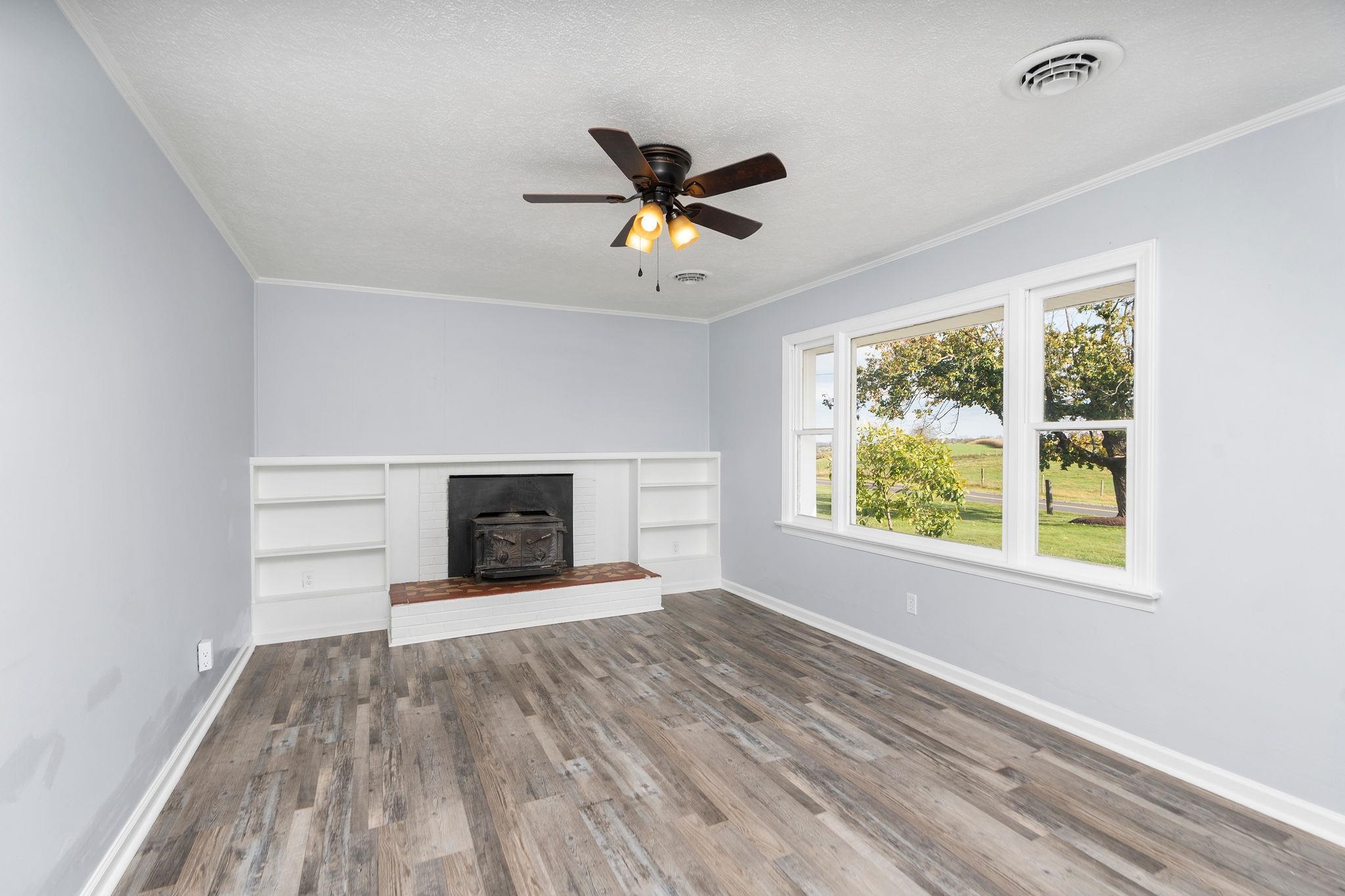 1111 Jennings Gap Road Churchville, VA 24421 - Photo 20 of 75 a view of an empty room with a window and wooden floor