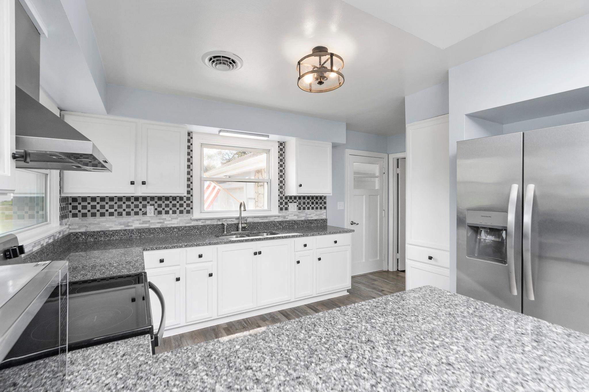 1111 Jennings Gap Road Churchville, VA 24421 - Photo 23 of 75 a large bathroom with a granite countertop sink and a mirror