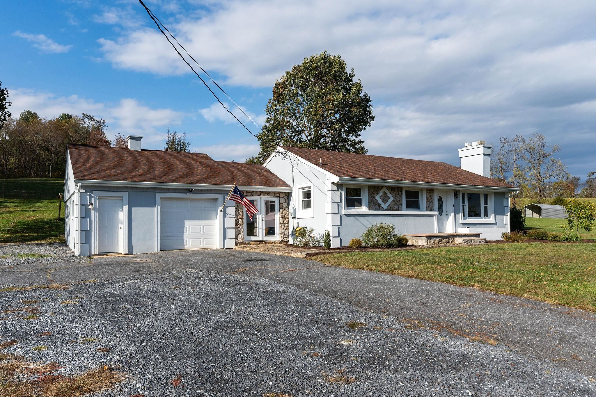 1111 Jennings Gap Road Churchville, VA 24421 - Photo 6 of 75 a front view of a house with a garden and pathway