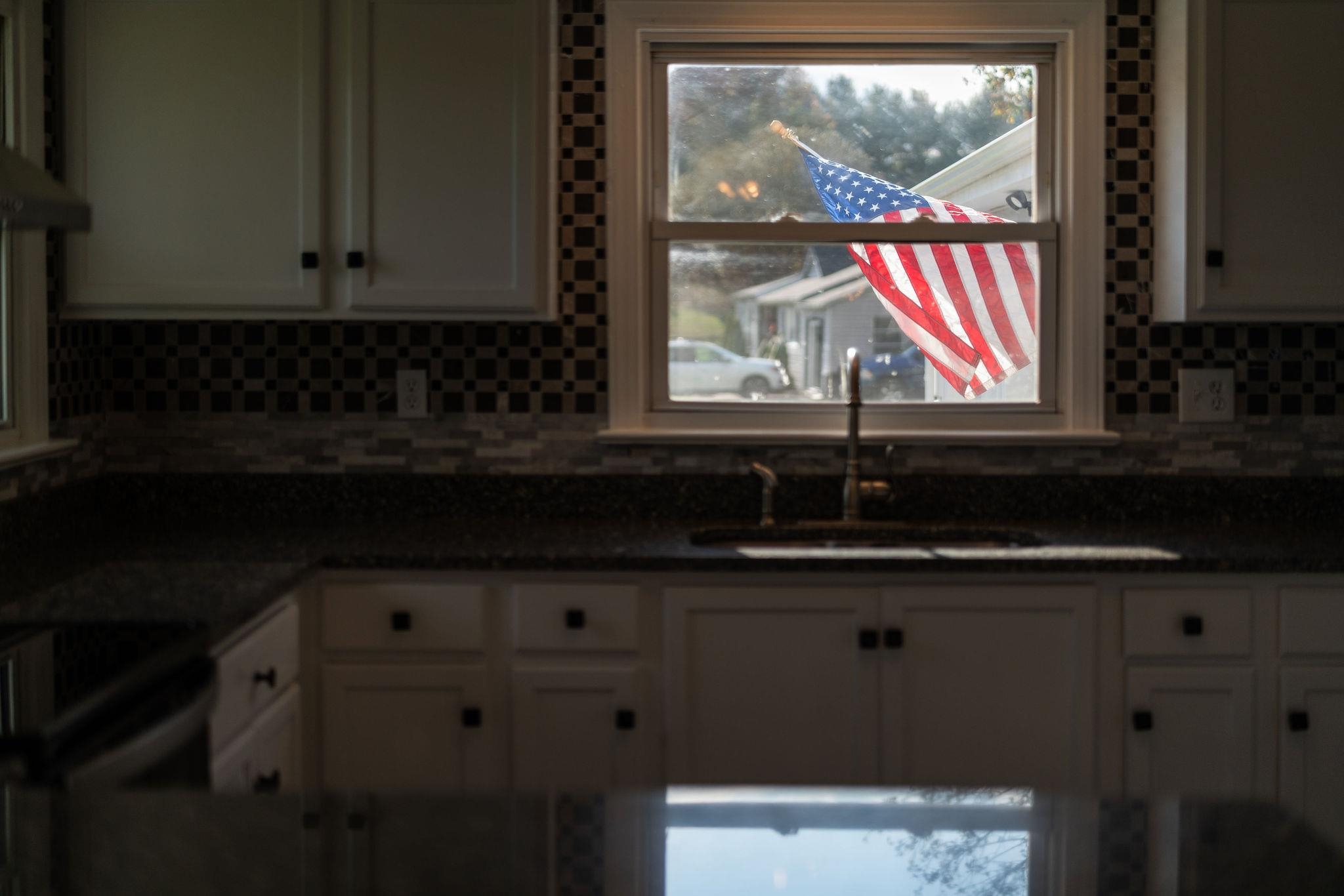 1111 Jennings Gap Road Churchville, VA 24421 - Photo 68 of 75 a kitchen with granite countertop white cabinets and window