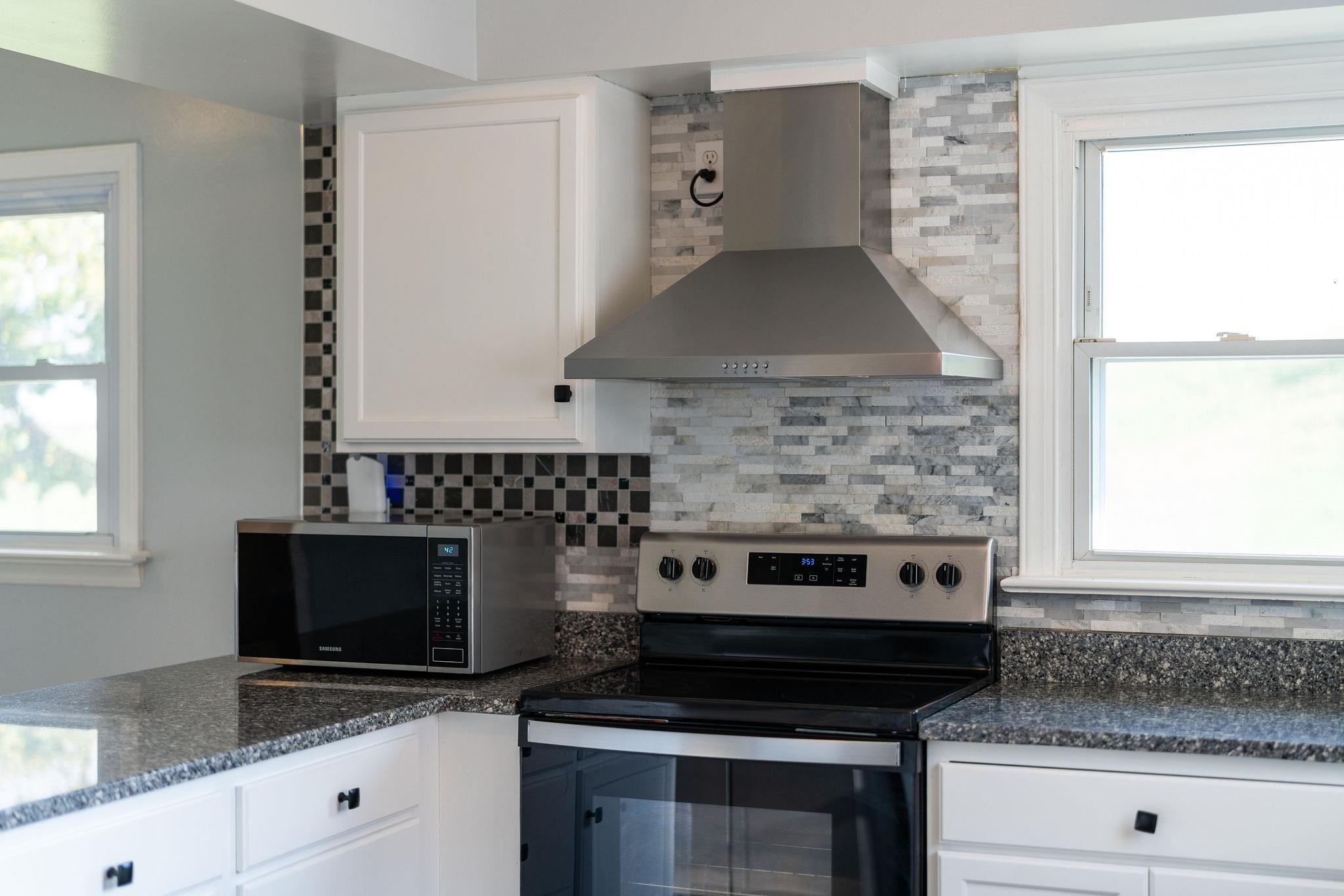 1111 Jennings Gap Road Churchville, VA 24421 - Photo 72 of 75 a kitchen with stainless steel appliances a stove and a microwave