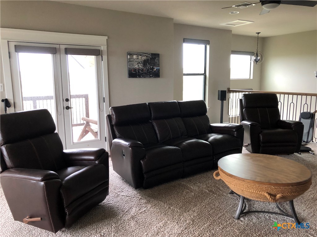 407 Havasu Point Spring Branch, TX 78070 - Photo 17 of 36 a living room with furniture and a large window