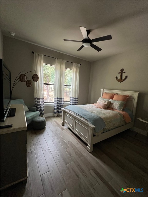 407 Havasu Point Spring Branch, TX 78070 - Photo 23 of 36 a bedroom with a bed and a couch