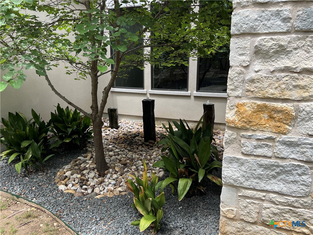407 Havasu Point Spring Branch, TX 78070 - Photo 28 of 36 a view of a bench in the garden