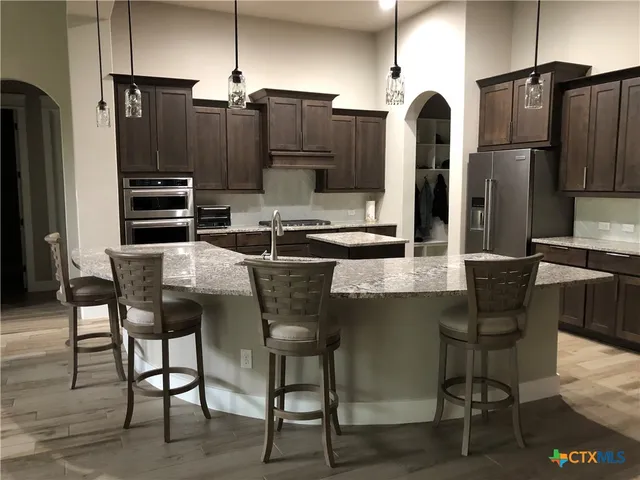 a bathroom with a granite countertop sink mirror and double
