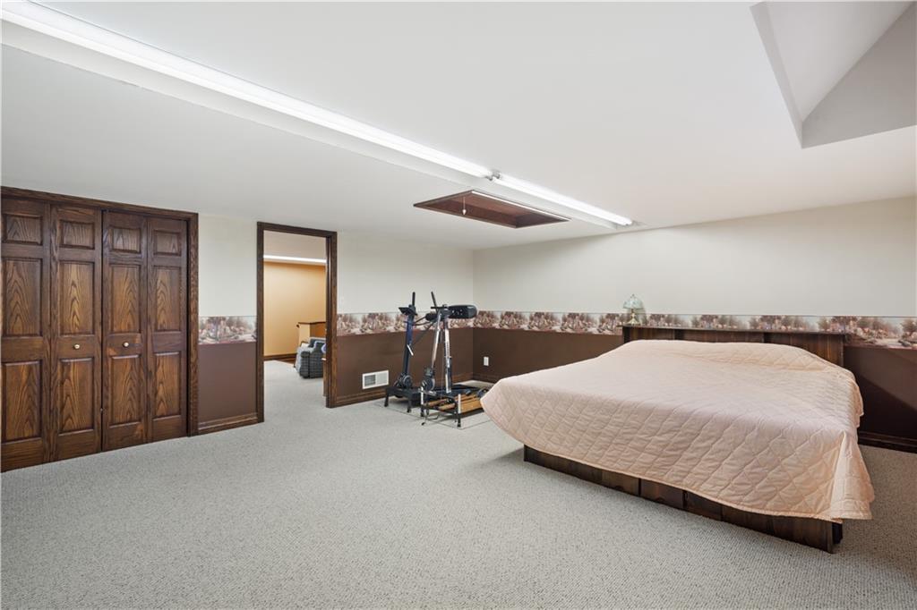 243 Clark Road Perryopolis, PA 15473 - Photo 29 of 45 a bed room with a bed and a night stand