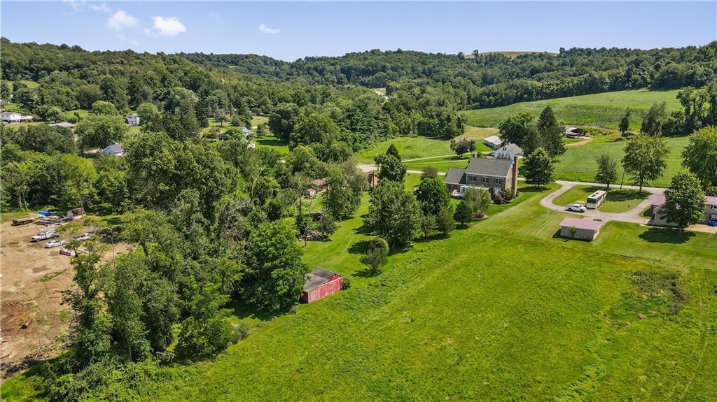 243 Clark Road Perryopolis, PA 15473 - Photo 38 of 45 a view of a lush green forest with a mountain