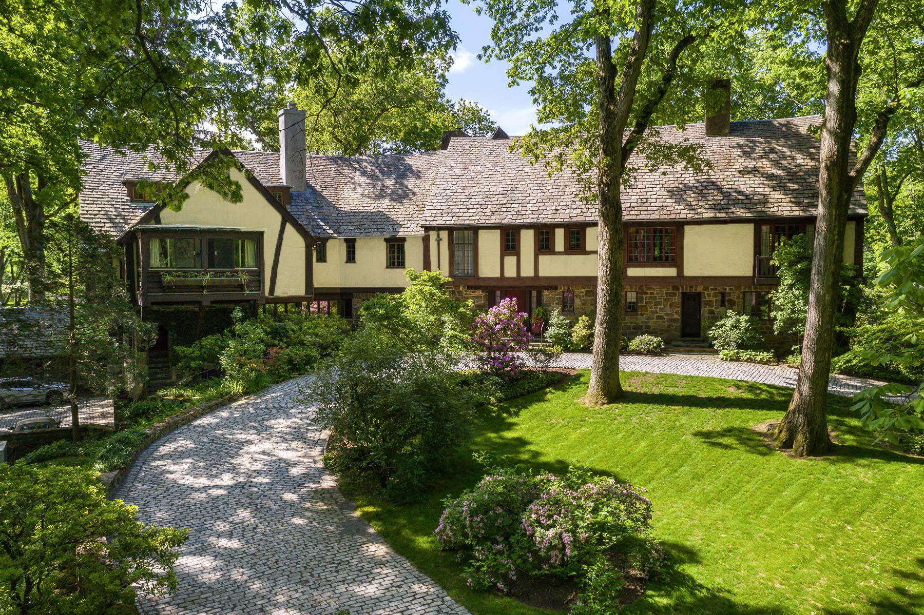 335 Croton Dam Road Ossining, NY 10562 - Photo 3 of 45 View of front of house featuring a front lawn, stucco siding, a chimney, and stone siding
