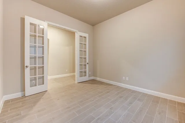 a bathroom with a sink toilet vanity and shower