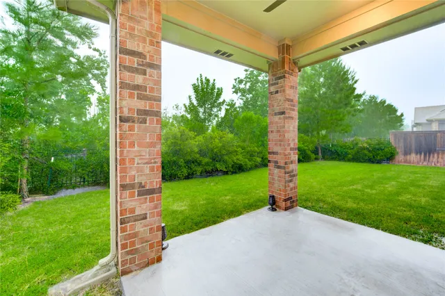 a view of a kitchen with a sink and a stove top oven