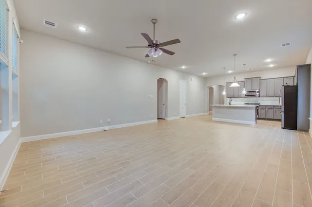 a view of a kitchen with a sink and a stove top oven