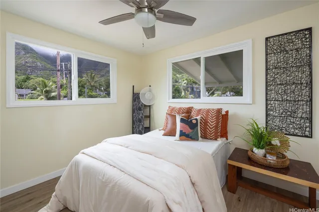 a bedroom with a large bed and a chandelier