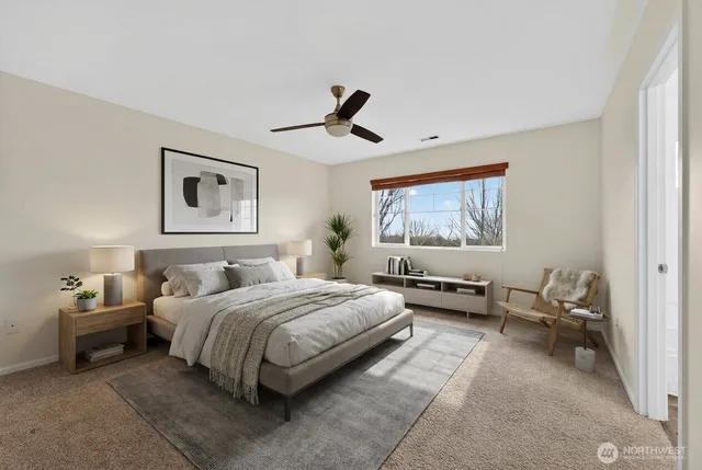 a bedroom with a bed and window