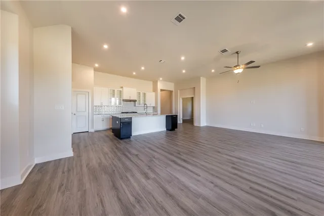 a view of kitchen with wooden floor and window